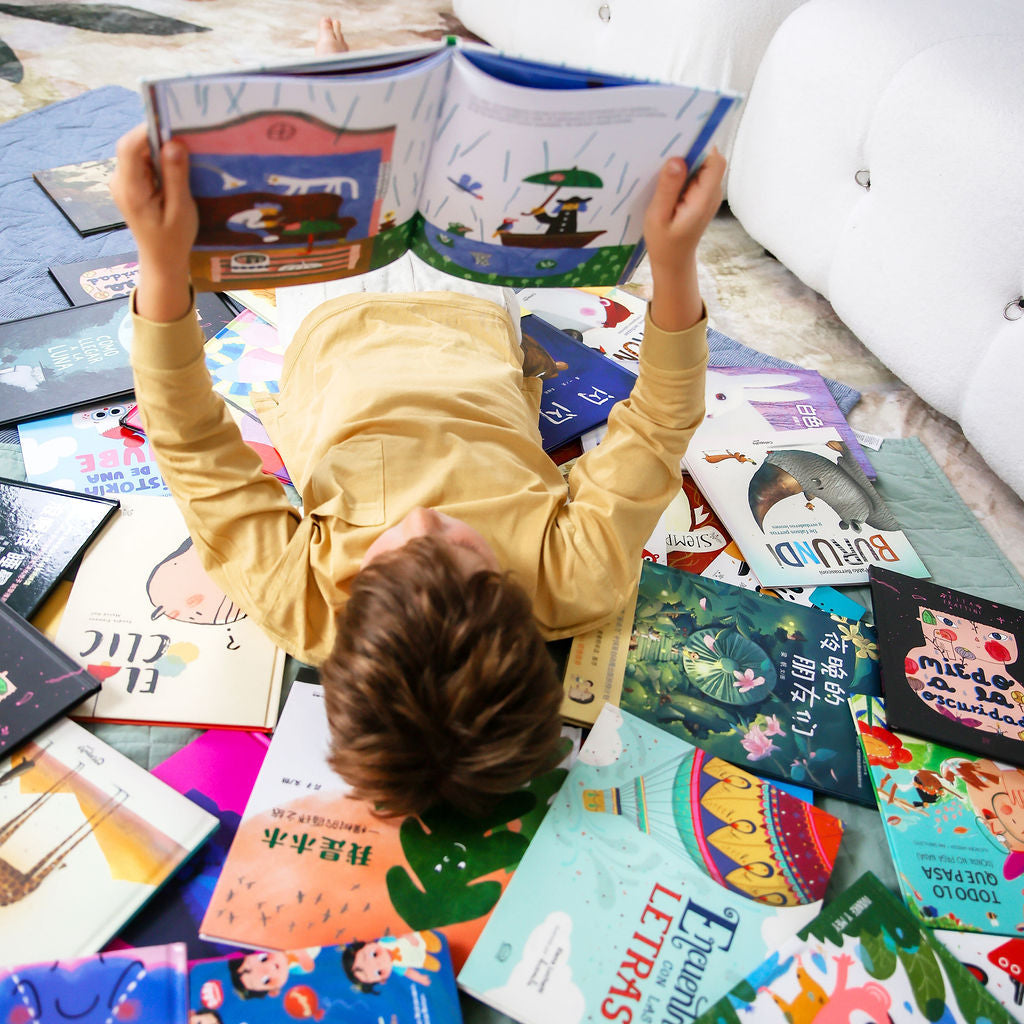 Kid surrounded by books 