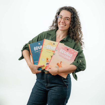 Woman holding books with a plain background